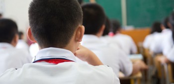 24285510 - group of middle school students studying in classroom