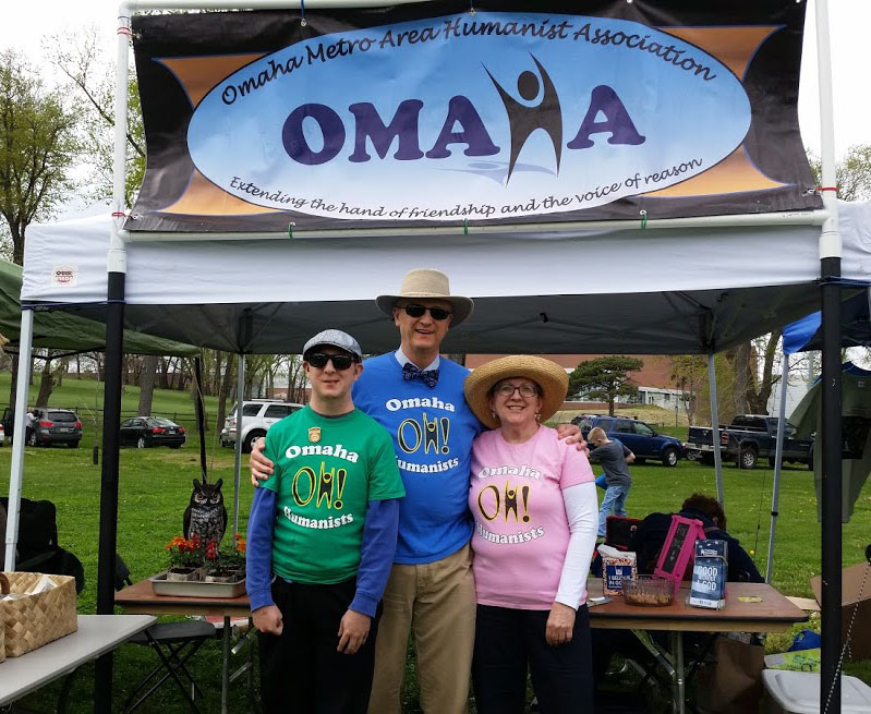 Humanists represent the Omaha Metro Area Humanist Association at their Earth Day booth at Elmwood Park on April 16, 2016.