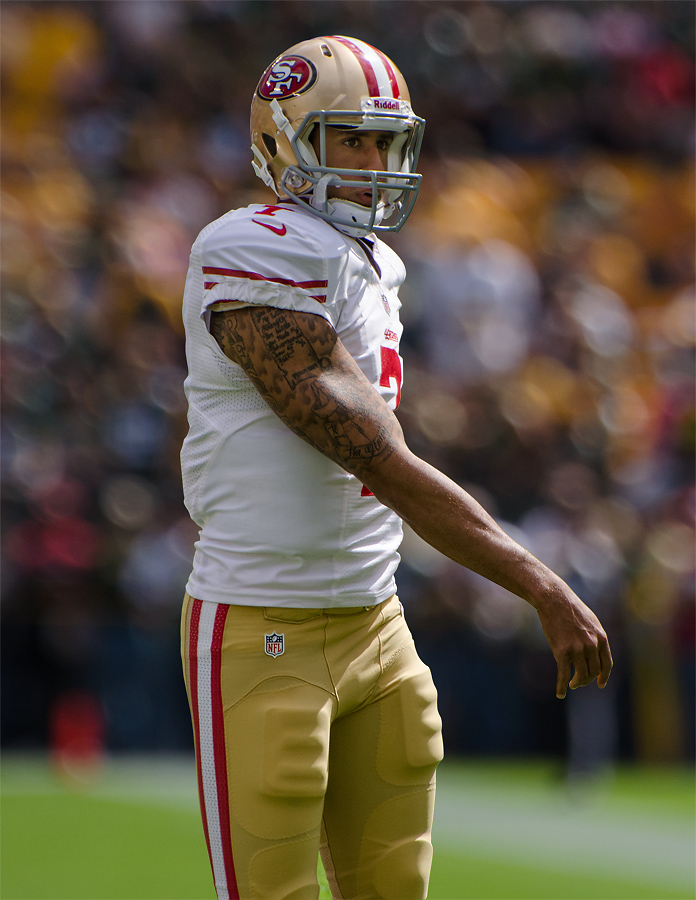 POLL: Is San Francisco 49'ers QB Colin Kaepernick at fault for choosing to  sit during the national anthem?